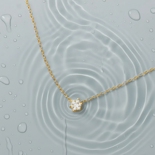Gold plated waterproof necklace inside water