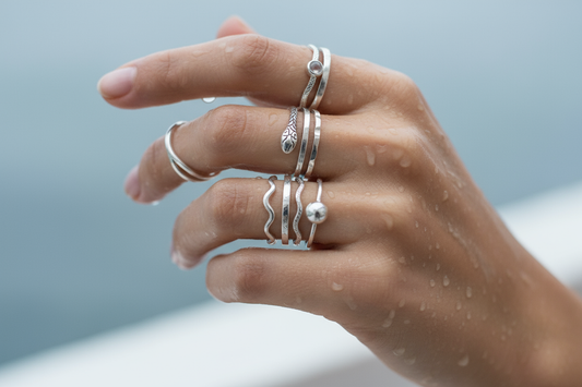 Silver waterproof rings on a women's hand