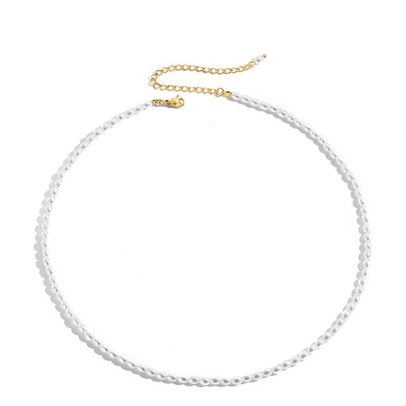 Gold waterproof pearl choker necklace with a white background 