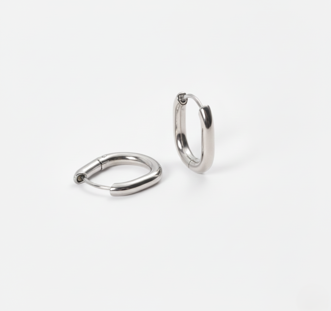 Pair of silver hoop earrings on a white background