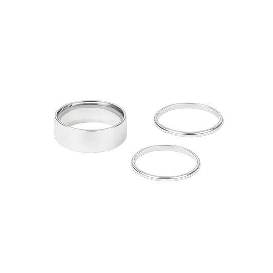Three silver rings of different sizes on a white background
