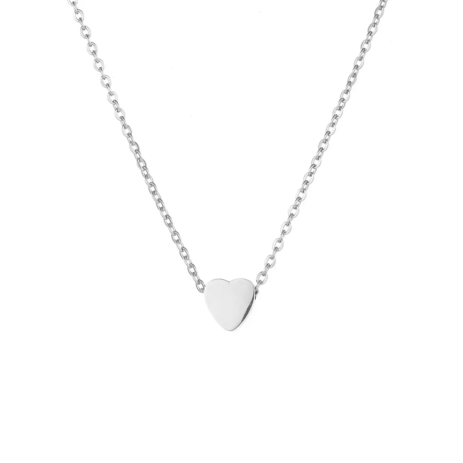 Silver stainless steel heart pendant on a chain against a white background