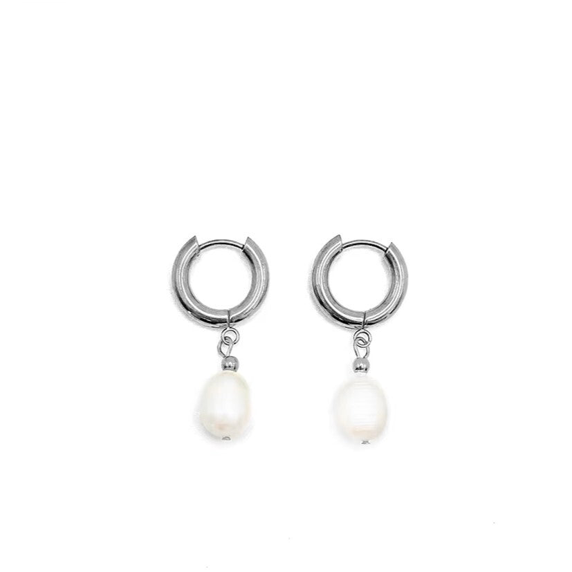 Silver stainless steel hoop earrings with pearl drops on a white background