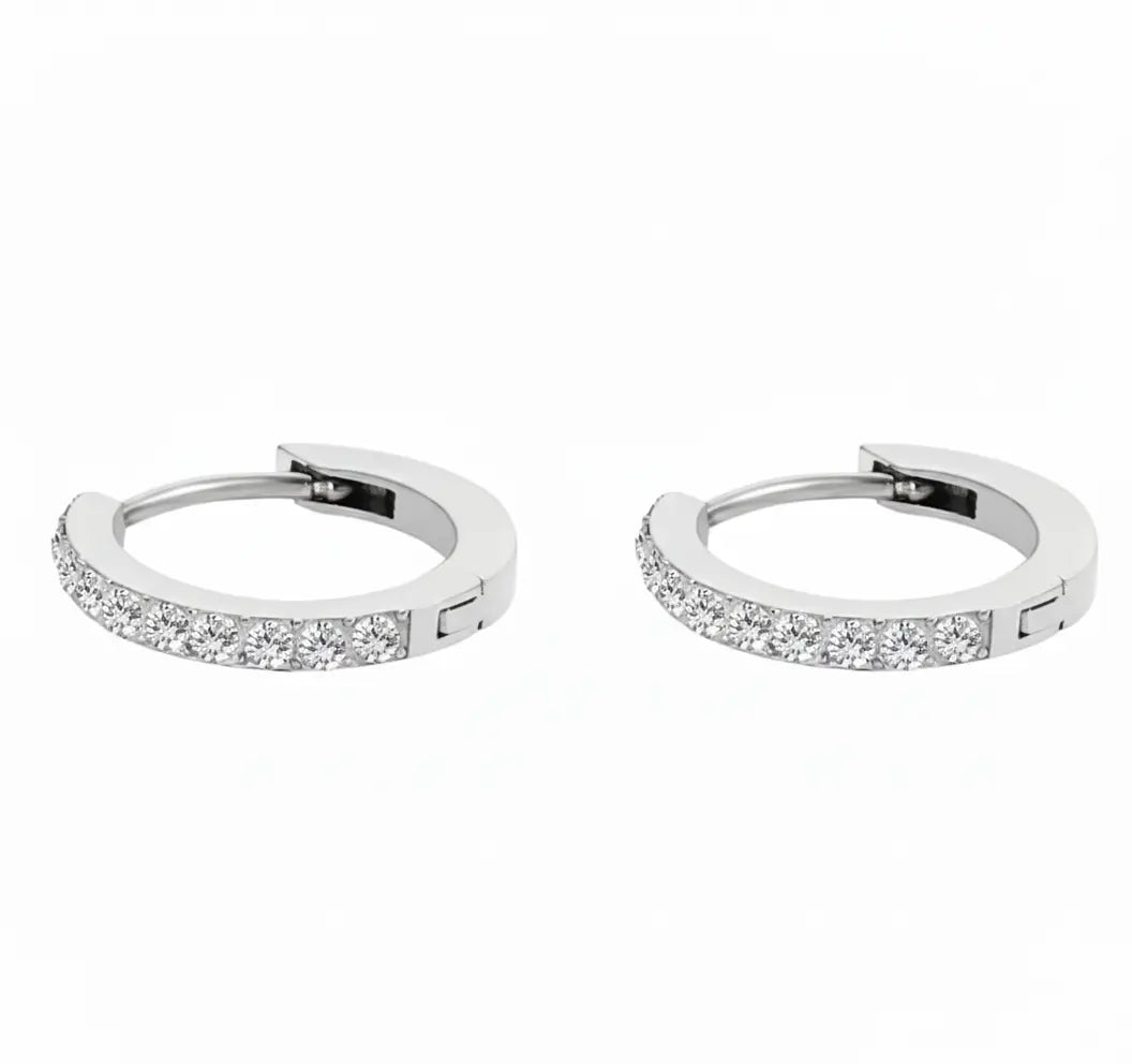 Silver-plated hoop earrings with embedded diamonds on a white background