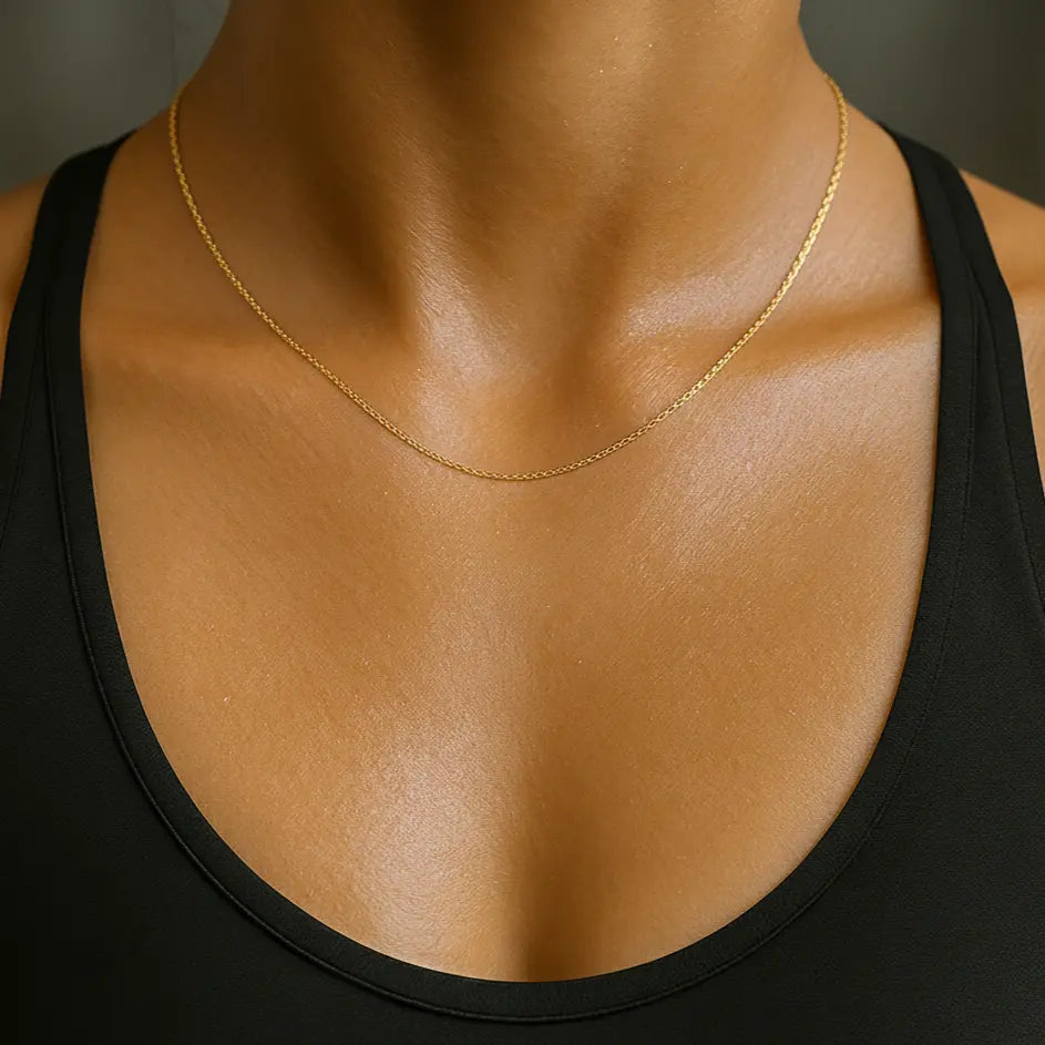 Close-up of a woman wearing a gold-plated necklace 