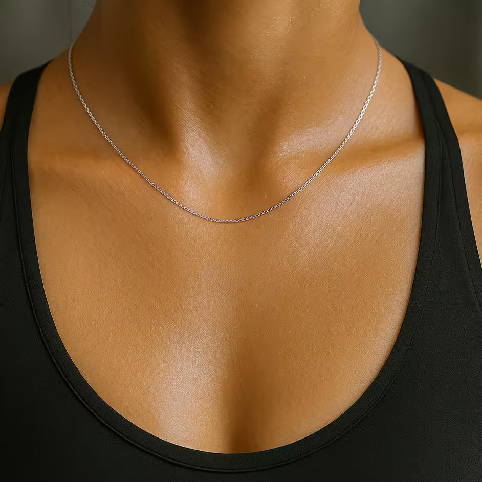 Close-up of a woman wearing a gold-plated necklace 